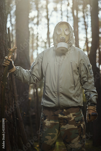 man in a gas mask protects himself from coronavirus