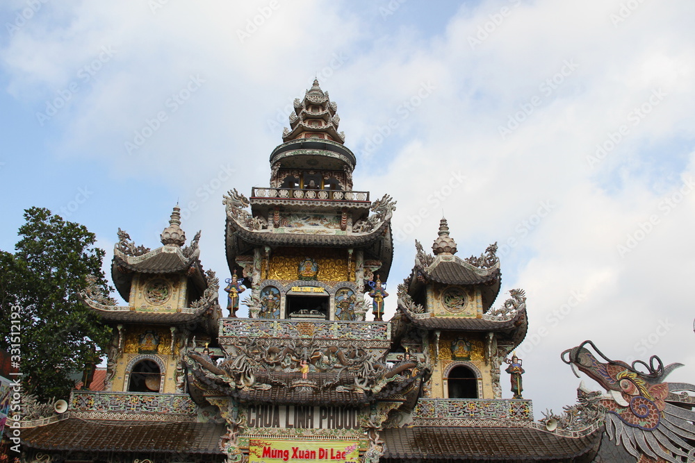 The main building of the bottle temple of the Buddhist pagoda Lin Phuoc in Dalat with a dragon figure, Vietnam