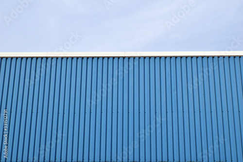 Blue Painted Corrugated Steel Wall on Side of Industrial Unit & Blue Sky 