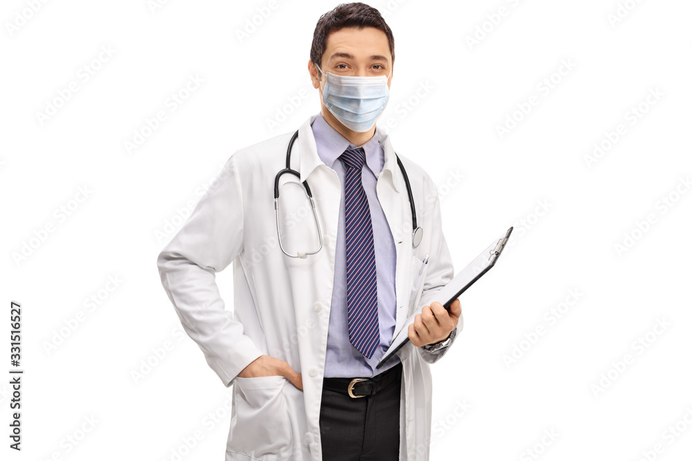 Young male doctor holding a clipboard and wearing a medical face mask Young male doctor holding a clipboard and wearing a medical face mask