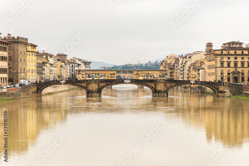 Beautiful Sights of Ponte Vecchio Bridge and Arno River in Florence, Italy.