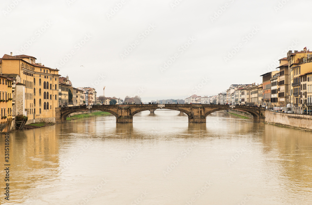 Beautiful Sights of Ponte Vecchio Bridge and Arno River in Florence, Italy.