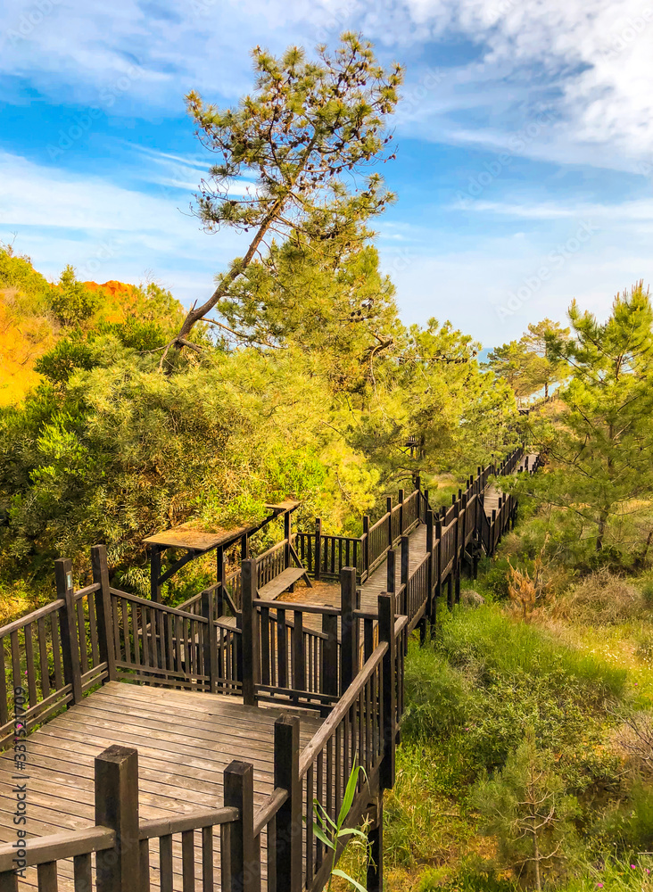 A wooden walkway to the beach in Algarve, Portugal A wooden walkway to the beach in Algarve, Portugal