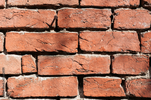 Old, rustic red brick wall. Background, texture, pattern