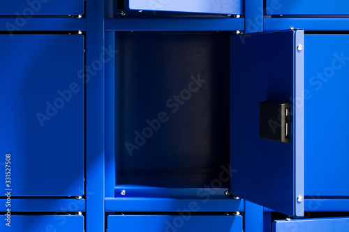 Fotografie, Obraz Blue Safe Deposit Boxes With One Opened Locker