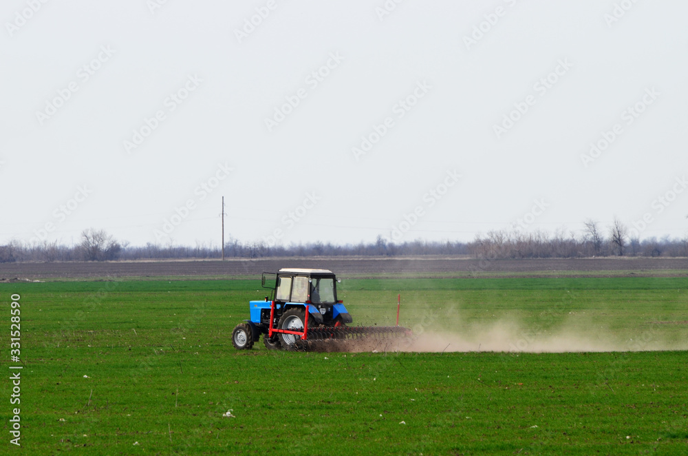 Tractor cultivates land on the field ,Ukraine. Tractor cultivates land on the field ,Ukraine.