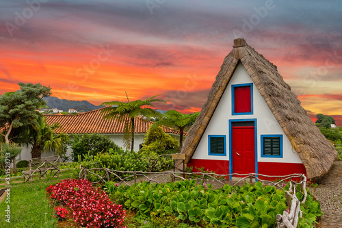 Madeira island rural traditional house sunset village landscape, Portugal, Santana photo