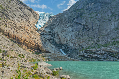 Glacier melting ice lake, Norway, National park Jostedalsbreen mountain landscape view.