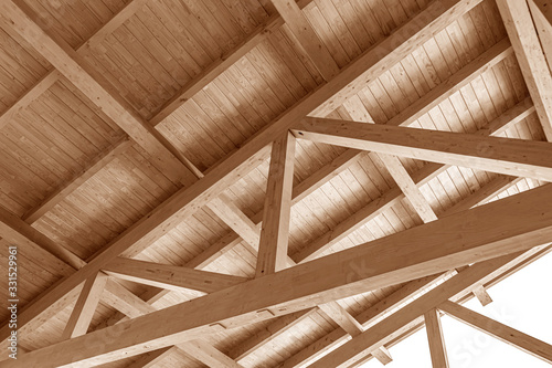 The construction of the wooden roof. Detailed photo of a wooden roof overlap construction. photo