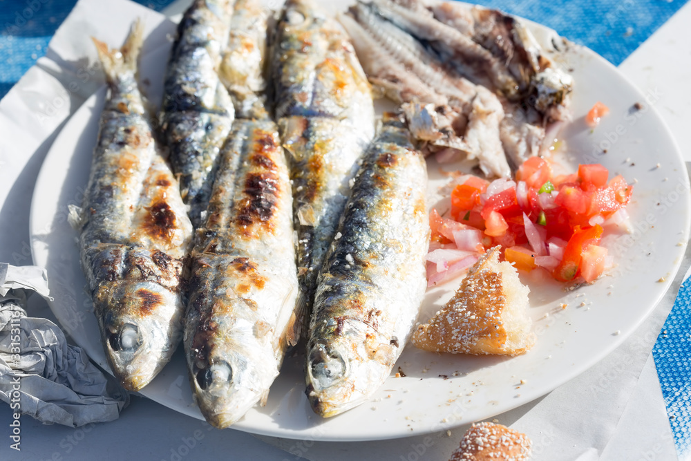 Grilled sardines with moroccan tomato salad