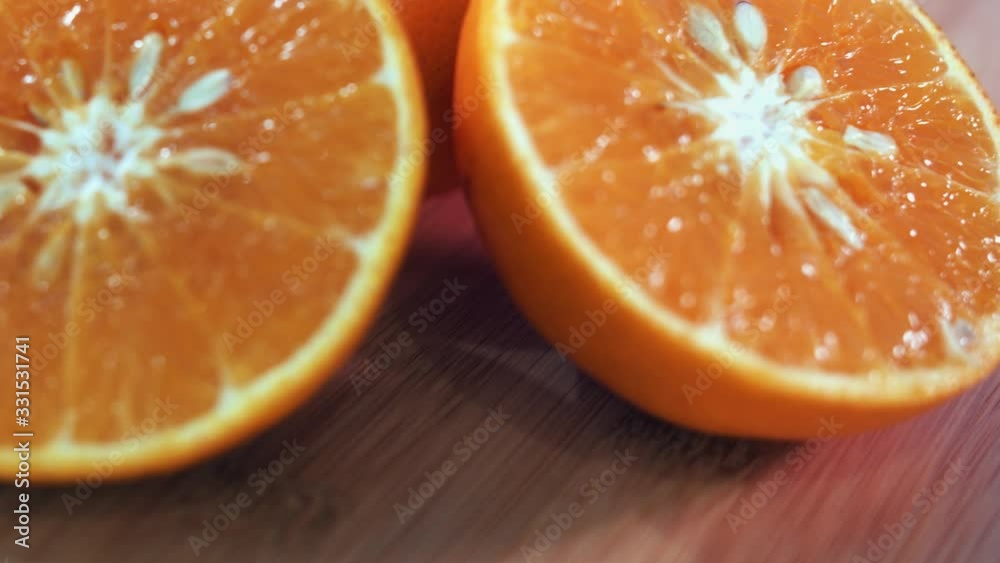 Close Interior Static Shot of Half Cut Oranges on Spinner in the Day Close Interior Static Shot of Half Cut Oranges on Spinner in the Day