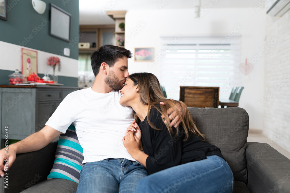 Romantic Hispanic Couple Relaxing At Home Romantic Hispanic Couple Relaxing At Home