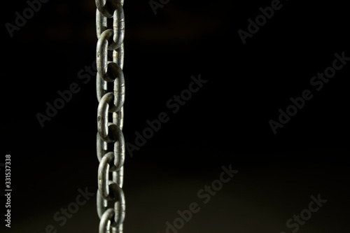 chain on a black background © alebor79
