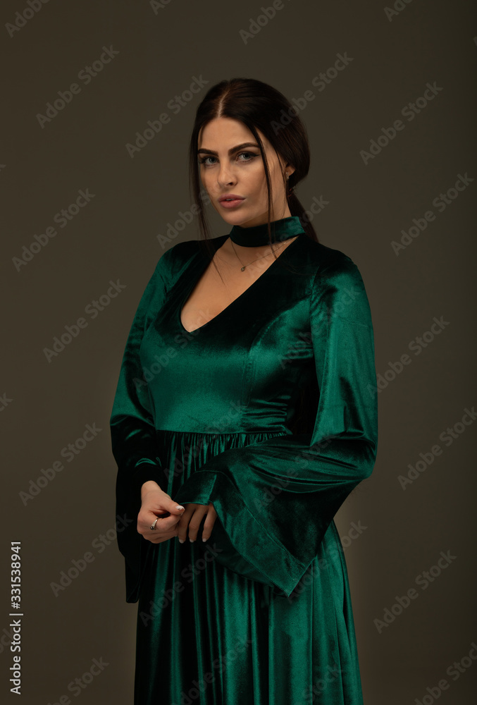 Cute woman in gorgeous green dress. Cute woman in gorgeous green dress.