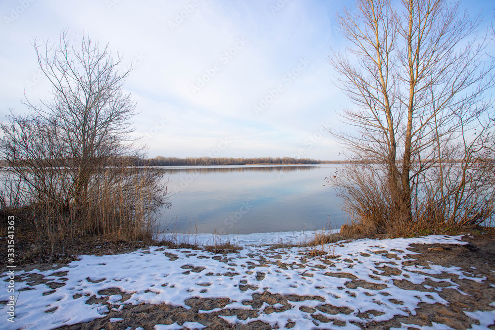 Beautiful winter landscape of a frozen river