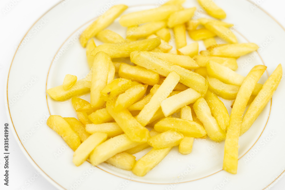 French Fries served on the white plate French Fries served on the white plate