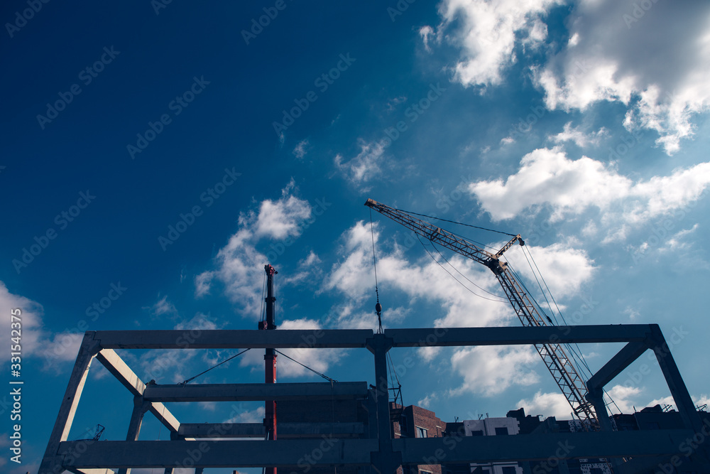 construction site with cranes on blue sky background construction site with cranes on blue sky background