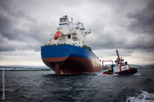 launching of renovated tanker cargo ship from dock to water.