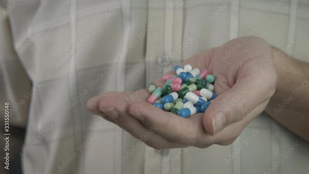 Painkillers pills in the hand. Painkillers pills in the hand.