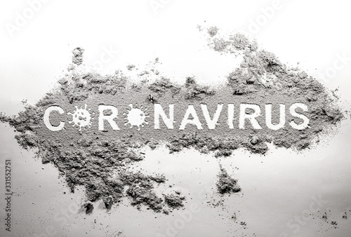 Coronavirus covid-19 danger word drawing in dust, dirt, ash as virus disease threath for health, death and sickness kill risk, bacteria germ microbe silhouette