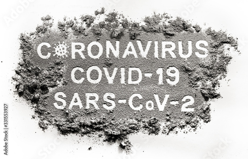 Covid-19 or coronavirus or sars-cov-2 disease virus with different names written in ash  dirt  filth or dust as global healthcare problem  deadly dangerous mankind epidemic sign