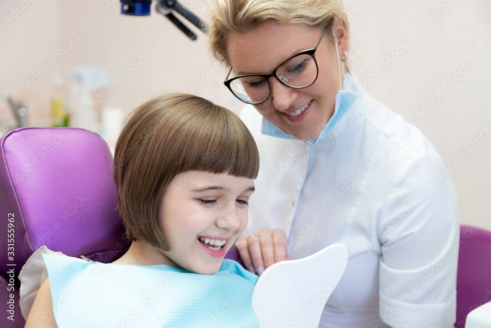Kid toothy smiling at looking mirror and dentist Kid toothy smiling at looking mirror and dentist