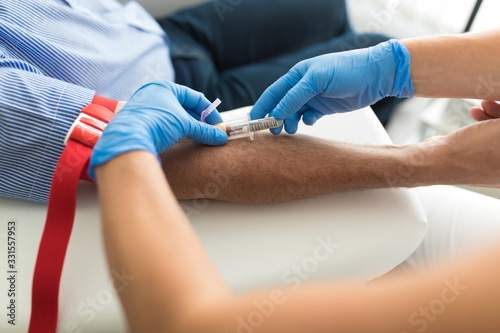 Senior man having a blood test done by a nurse
