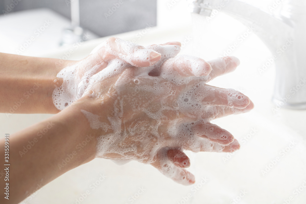 Fototapeta premium Washing hands. daily personal care against viruses, bacteria, microbes.