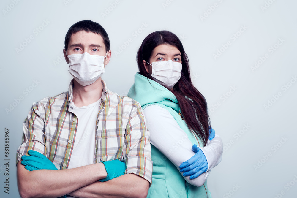 Portrait of woman and a man in medical mask and medical gloves. Portrait of woman and a man in medical mask and medical gloves.