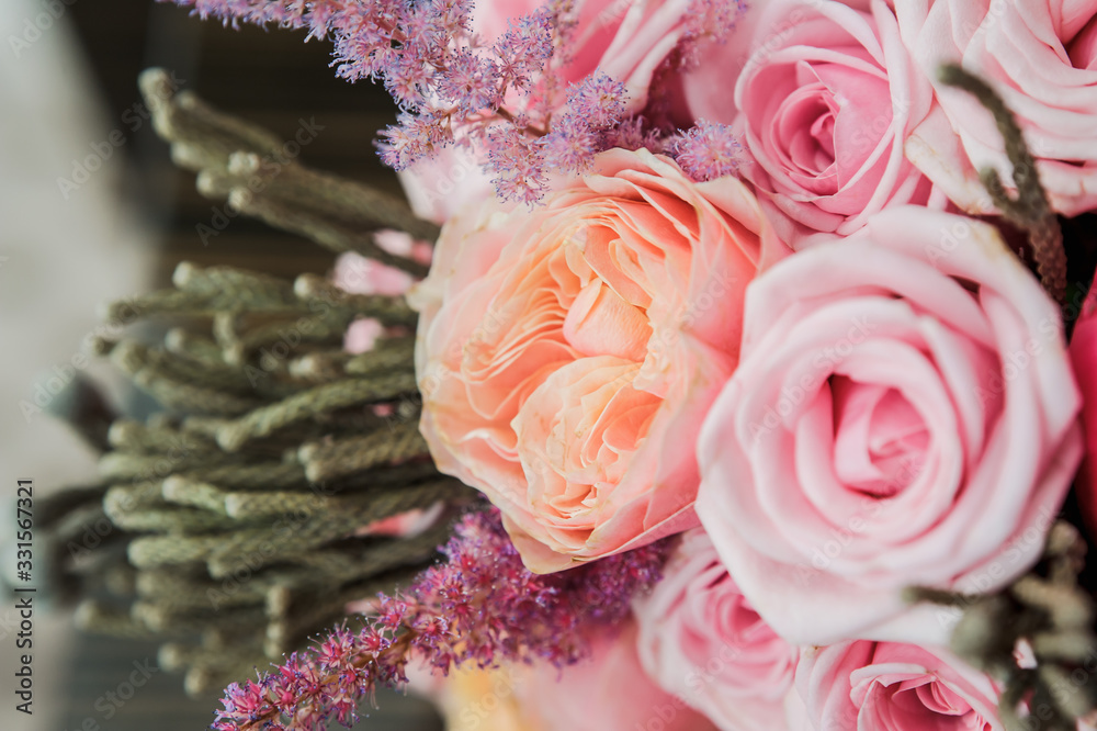Colorful wedding bouquet on a bed. Bridal bouquet, beige bedding. Luxury Moscow hotel room. Valentine's day or mother's day present Colorful wedding bouquet on a bed. Bridal bouquet, beige bedding. Luxury Moscow hotel room. Valentine's day or mother's day present