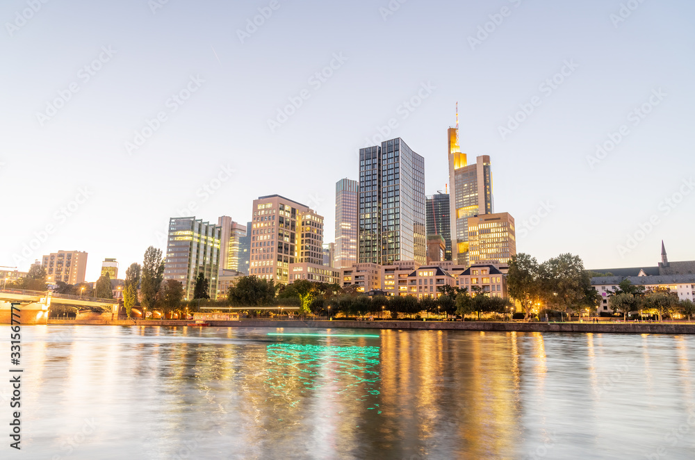 Modern skyline of Frankfurt, Germany. City river and buildings at night