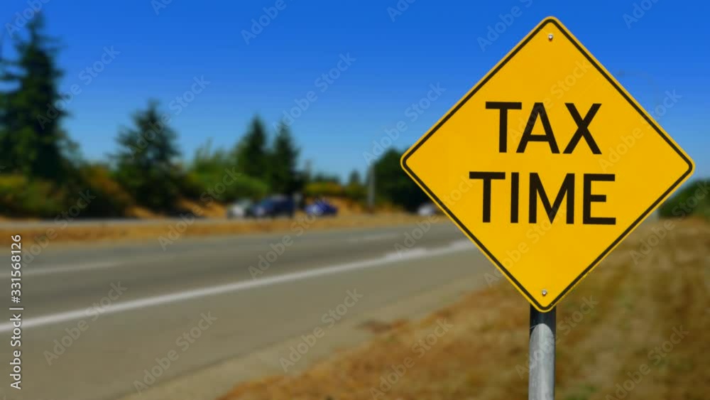 Tax Time Yellow Road Sign, Seamless Looping Video Tax Time Yellow Road Sign, Seamless Looping Video