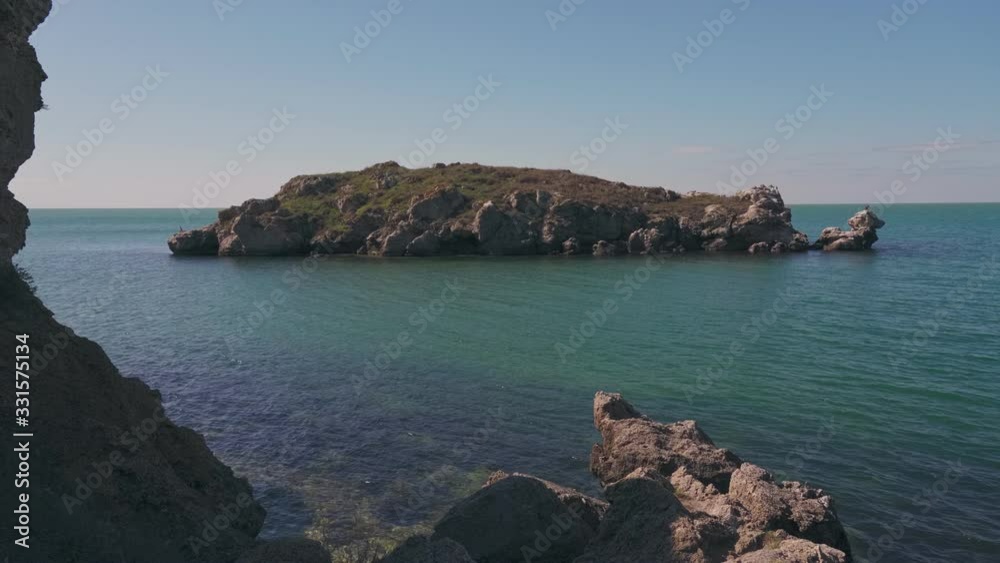 Beautiful landscape with birds on rock in the sea Beautiful landscape with birds on rock in the sea