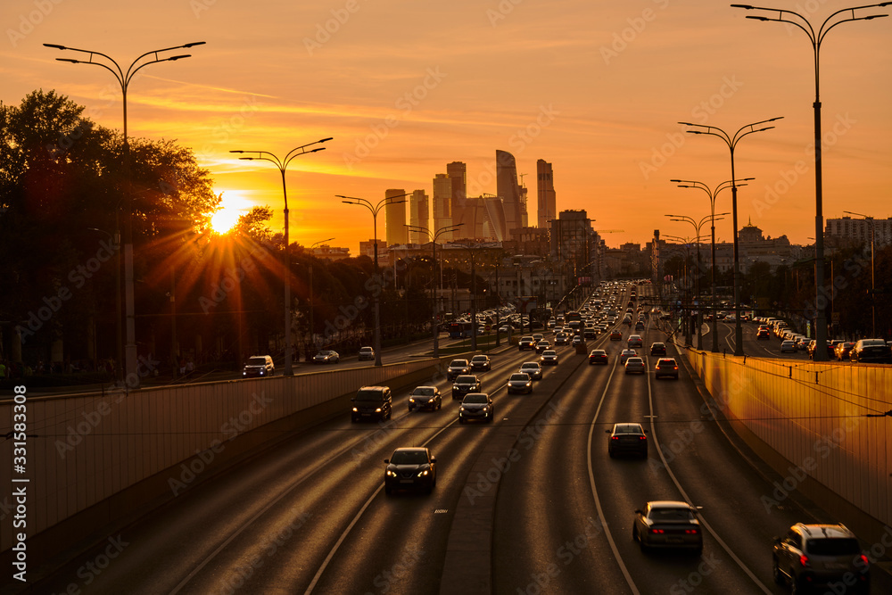 traffic in the downtown of Moscow with beautiful sunset for Moscow City. Russia