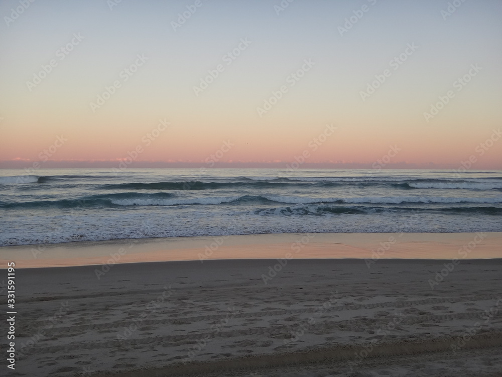 sunset on the beach - byron bay - australia