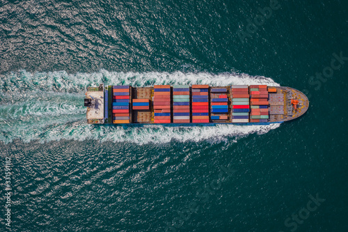 cargo ship sailing on the sea top view from drone photo