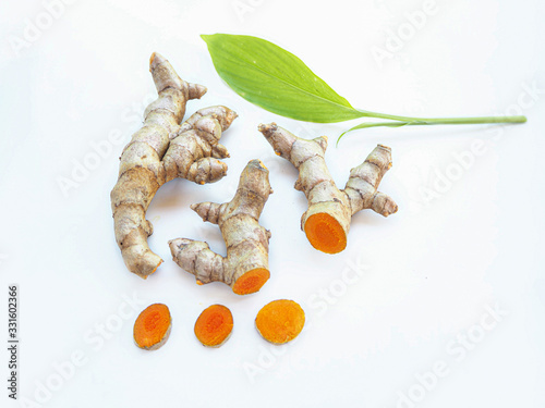 turmeric rhizome and slice or curcuma longa with leaf and use as ingredients cosmetics products and is a anti inflammatory and antioxidant, including is a herb use for health care.