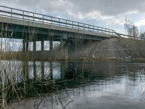 concrete bridge over the river, spring day