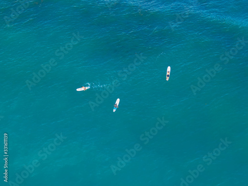 Beautiful aerial view Surfers in the Beach town of Jaco in Costa Rica