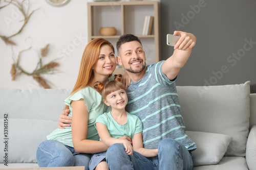 Family taking selfie at home