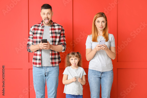 Family taking selfie on col...
