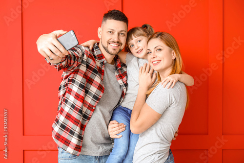 Family taking selfie on col...