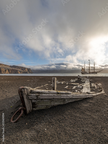 Fotografie old wooden boat at whalers bay south shetland islands antarctica with old sailin
