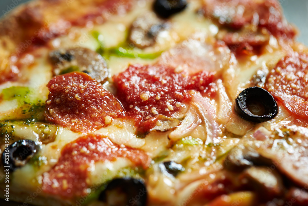 Salami and olive pizza close up Salami and olive pizza close up