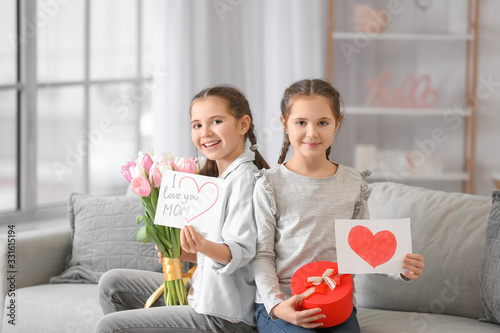 Little girls with gifts for...