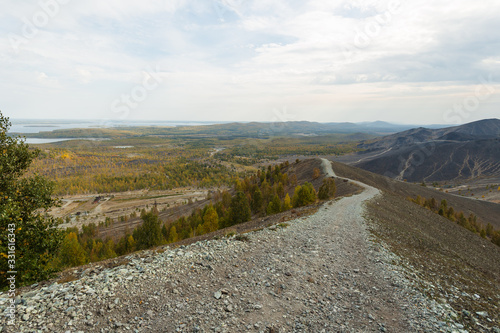 Steep mountain road. Ascent to the Pious Cross, Karabash. Chelyabinsk region, the dirtiest city on Earth