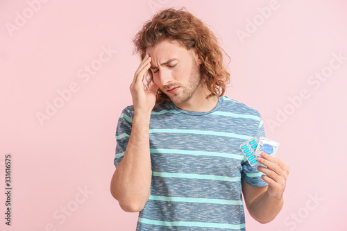 Sad young man with oral ere...