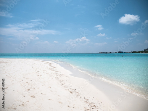 Fototapeta Naklejka Na Ścianę i Meble -  Tropical Beach with White Sand. Maldives Panorama. Idyllic Beach on Meeru Island.