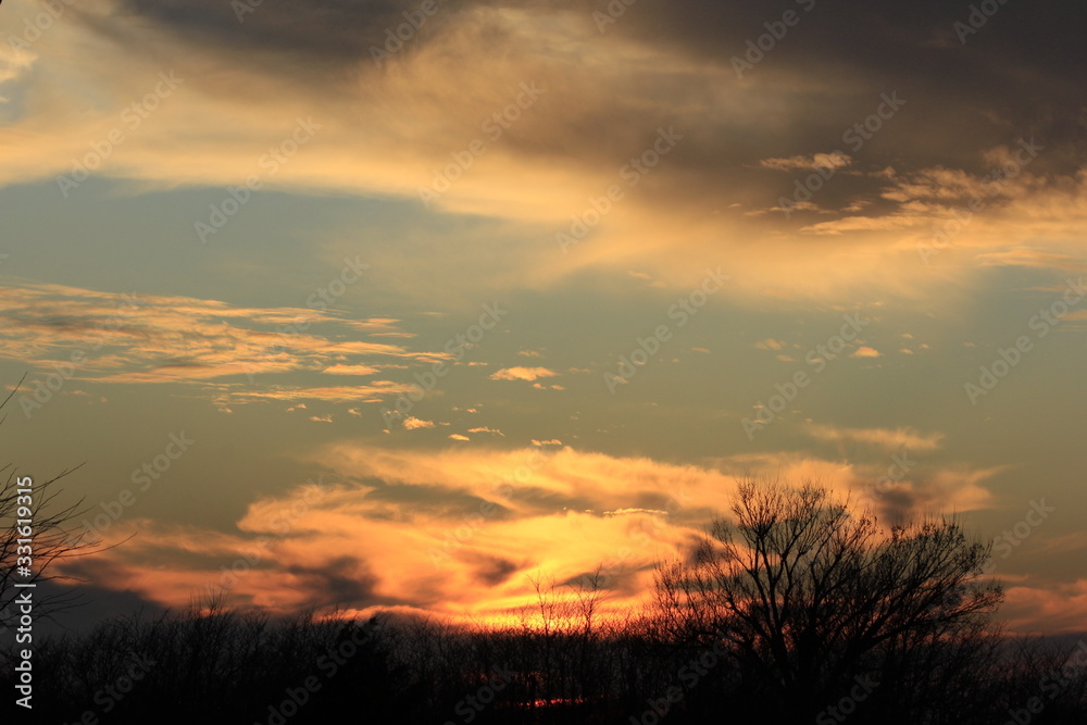 Sunset with clouds out in the country in Kansas. Sunset with clouds out in the country in Kansas.