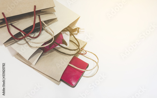 Quadro su tela The brown color paper shopping bags on soft white background with copy space